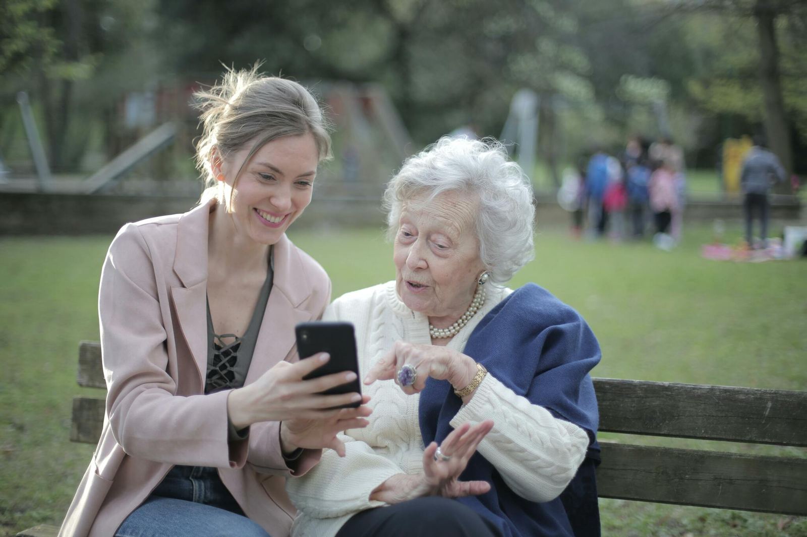 Learners studying together with a phone