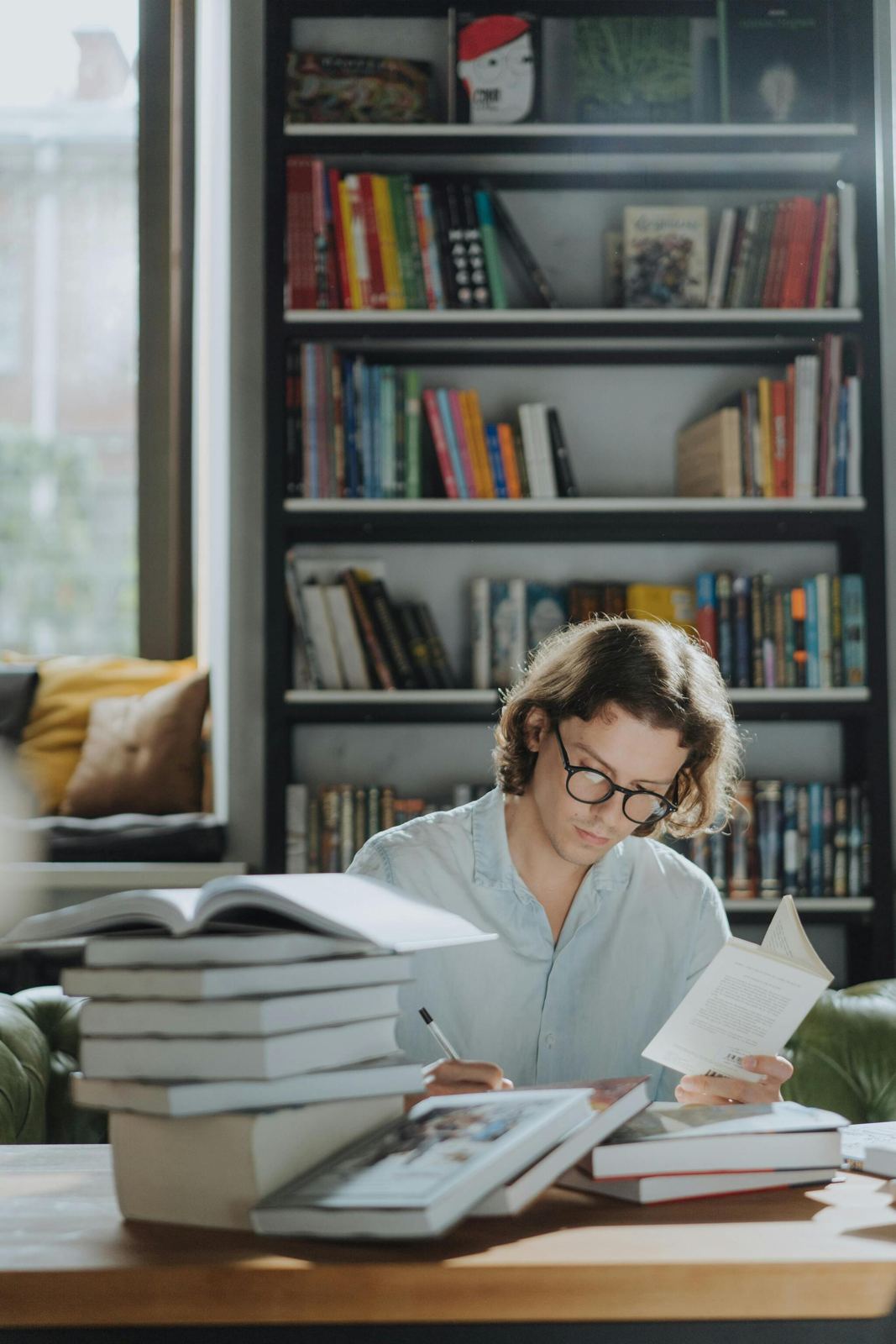 Student studying among books