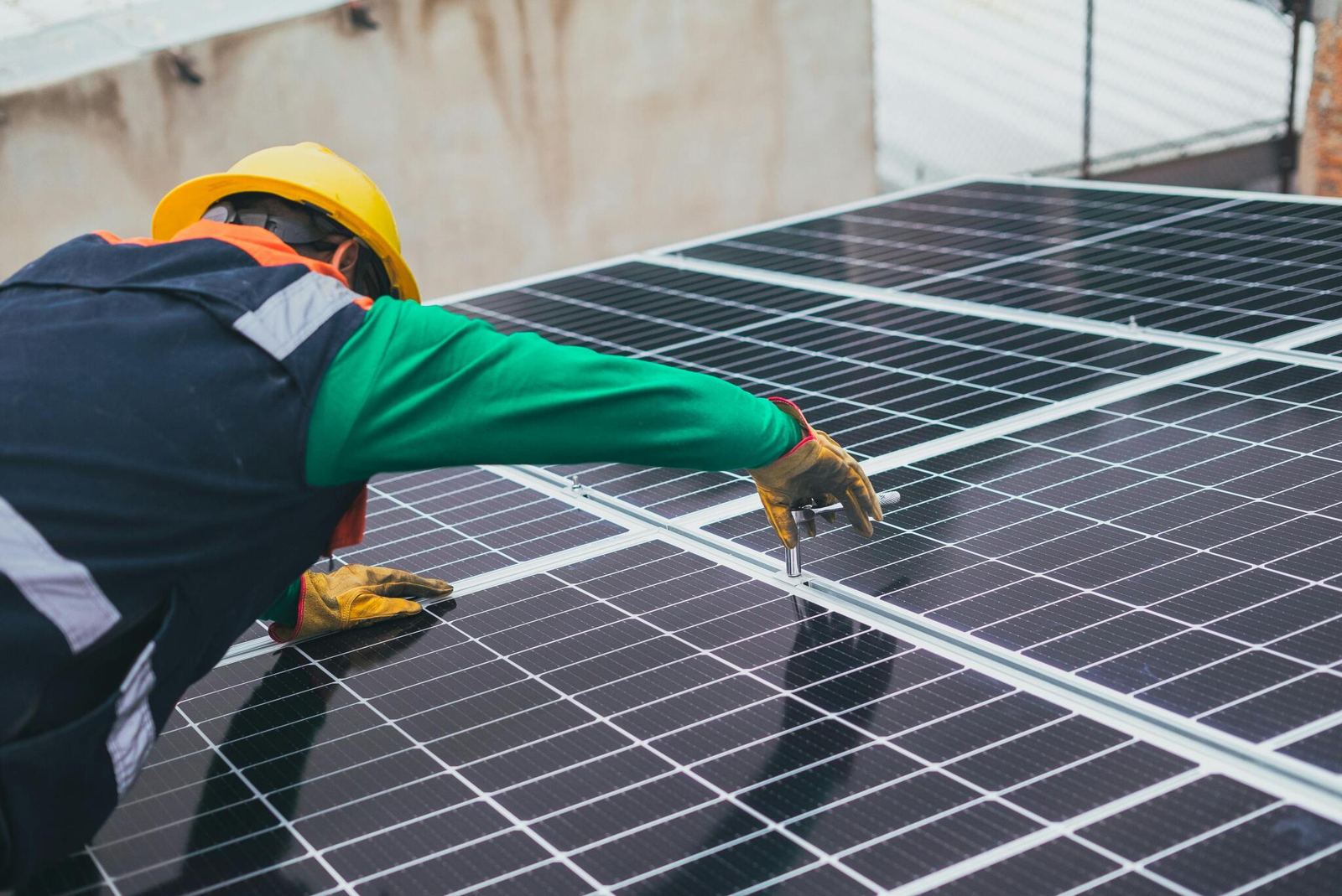 Technician installing solar panels