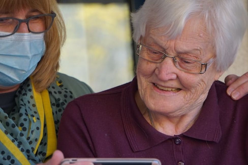 Caregiver supporting a senior at home
